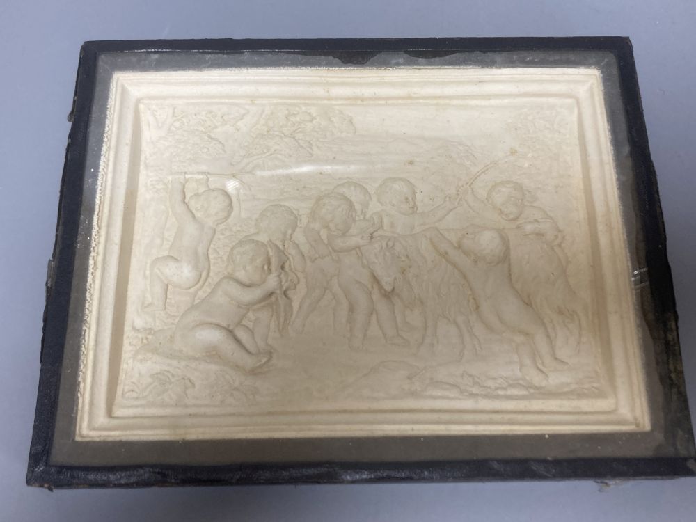 A Neapolitan pietra dura plaque, depicting a dog and a butterfly, 13 x 9cm and a moulded composition plaque